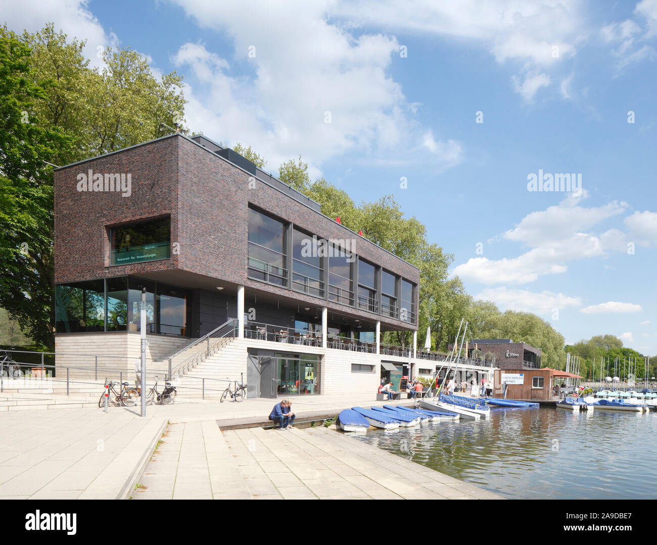 Restaurant Aaseeterrassen with boat harbor, Aasee, Münster in Westphalia, North Rhine-Westphalia, Germany Stock Photo
