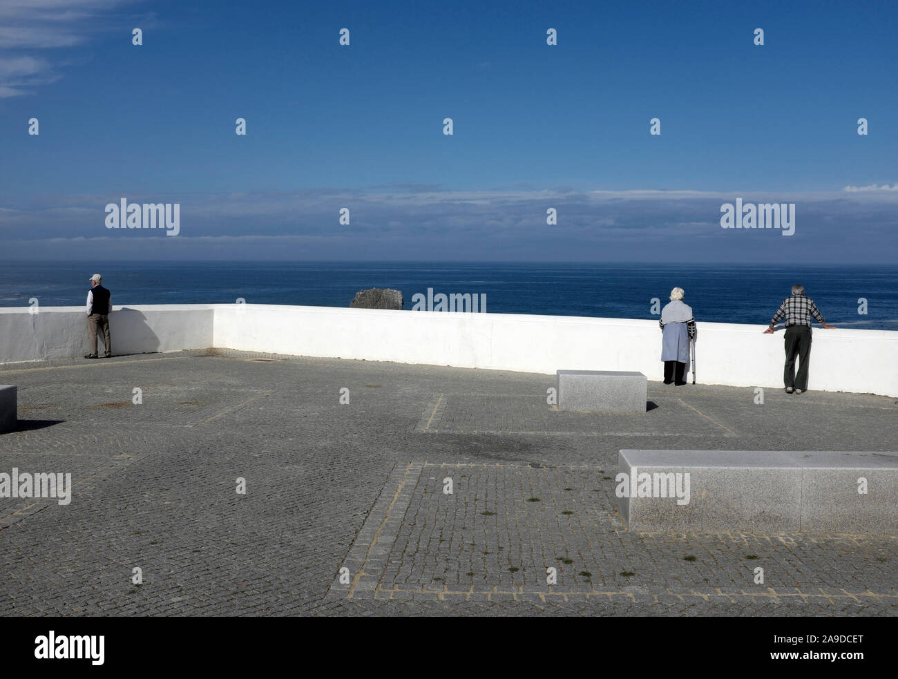 Lookout point in Odeceixe, pensioners looking out over the sea Stock Photo