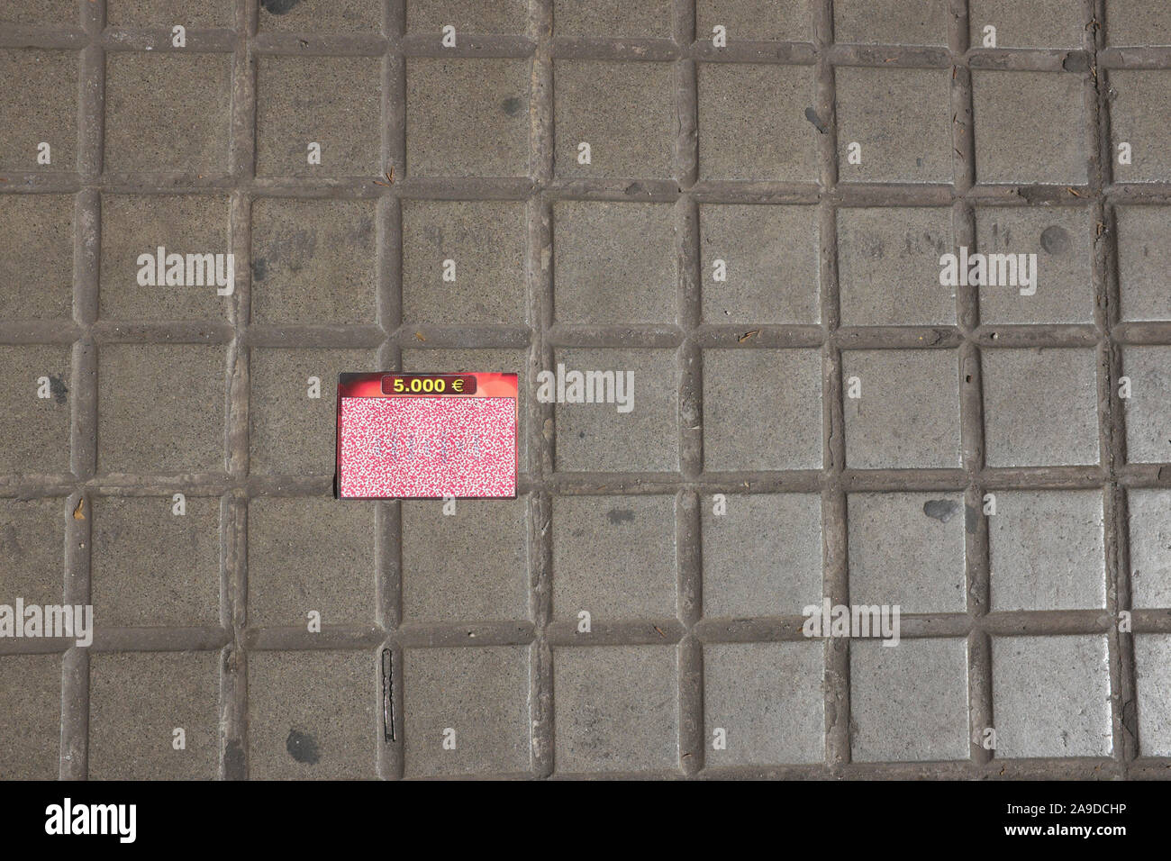 happiness is on the street, discarded lottery ticket Stock Photo