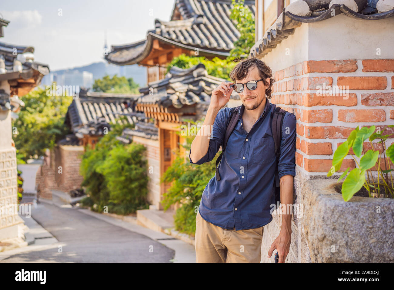 Young man tourist in Bukchon Hanok Village is one of the famous place ...