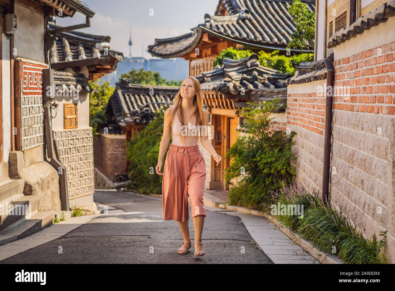 Young woman tourist in Bukchon Hanok Village is one of the famous place ...