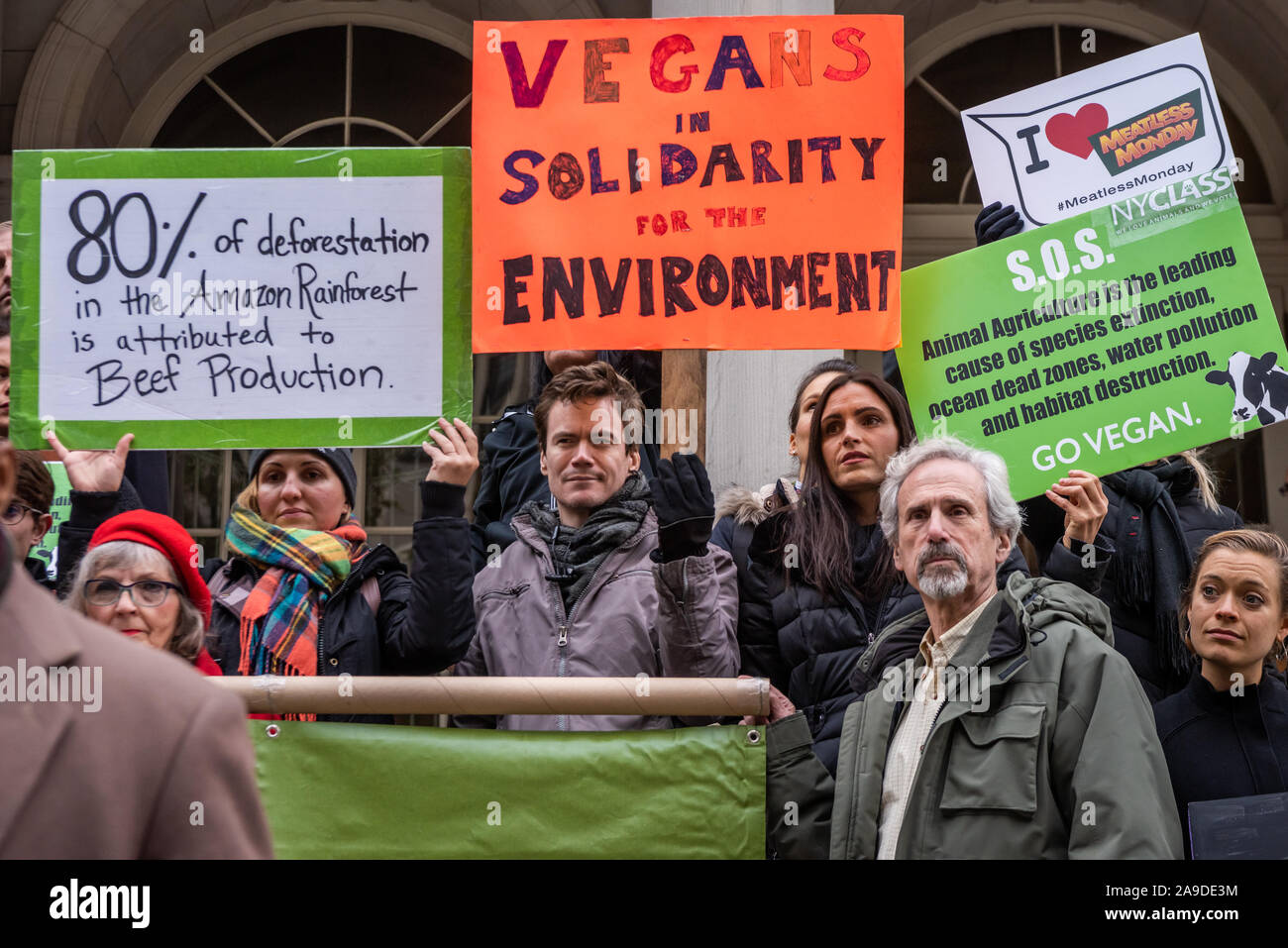 New York, USA. 14th Nov, 2019. Environmental activists on the steps of New York City Hall where Council Member Costa Constantinides and Eric Adams announce a resolution calling for ban on business with companies tied to the Amazon Wildfires in New York City on November 14, 2019. An annual 5% increased demand for beef has prompted South American ranchers to burn swaths of the historic rainforest, an asset in the fight against climate change, which have gone out of control. (Photo by Gabriele Holtermann-Gorden/Pacific Press) Credit: Pacific Press Agency/Alamy Live News Stock Photo