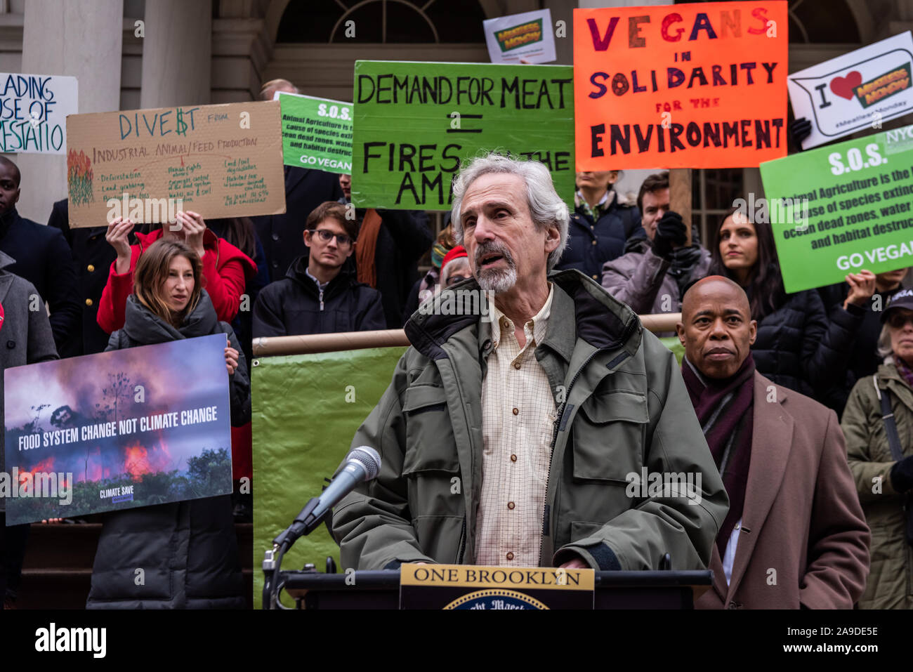 New York, USA. 14th Nov, 2019. Carl Arnold of the Sierra Club speaks at the press conference of Brooklyn Borough President Eric Adams and New York City Council Member Costa Constantinides who announced a resolution calling for ban on business with companies tied to the Amazon Wildfires on the steps of New York City Hall on November 14, 2019. An annual 5% increased demand for beef has prompted South American ranchers to burn swaths of the historic rainforest, an asset in the fight against climate change, which have gone out of control. (Photo by Gabriele Holtermann-Gorden/Pacific Press) Stock Photo