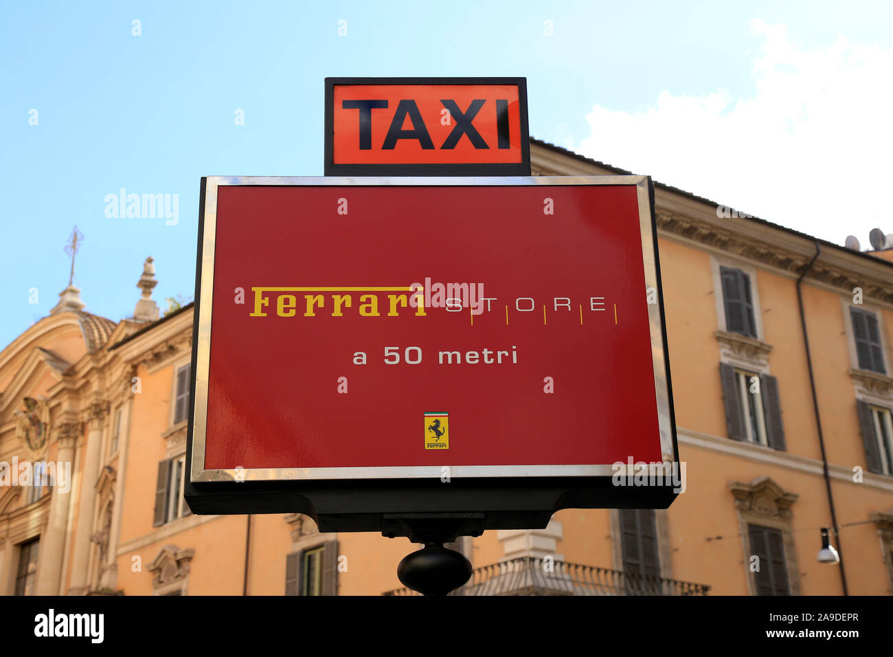 Taxi sign and Ferrari Store, Rome, Lazio, Italy Stock Photo
