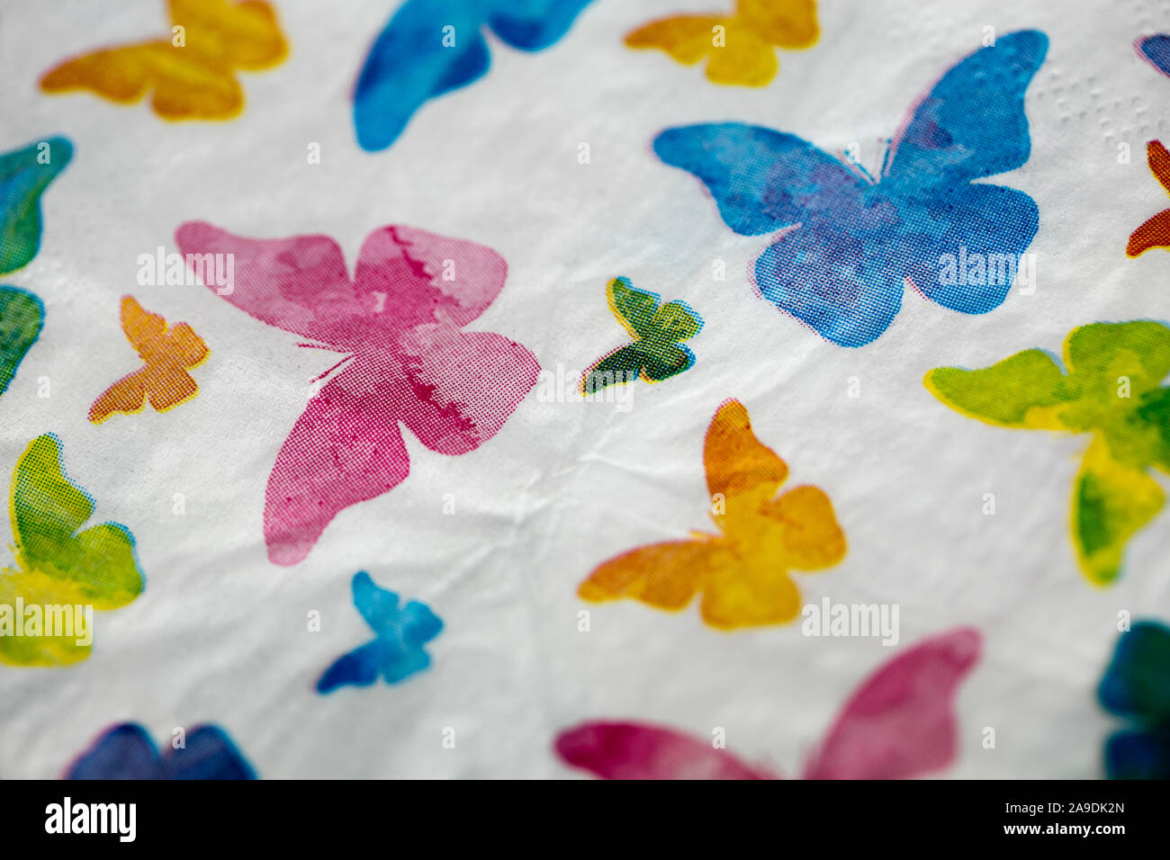 Colored butterflies shapes on white background macro fifty megapixels Stock Photo
