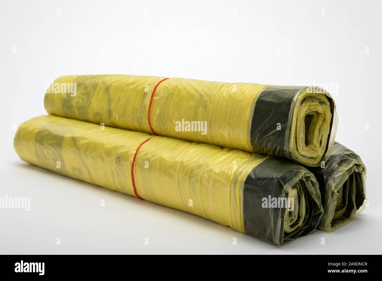 3 rolls of yellow sacks, plastic sacks for household waste separation, Stock Photo