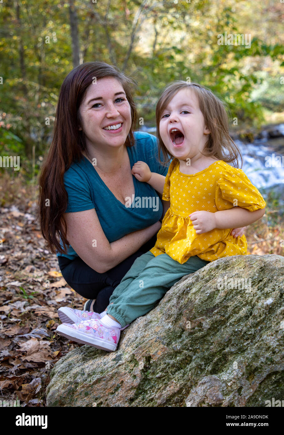 Daughter being silly yelling in woods Stock Photo