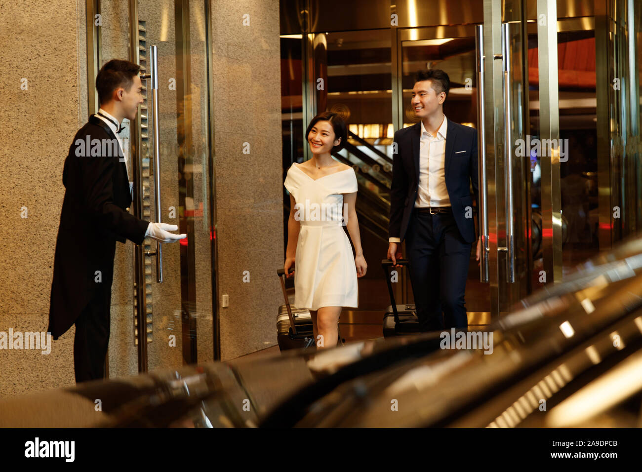 Couple leaving hotel hi-res stock photography and images - Alamy
