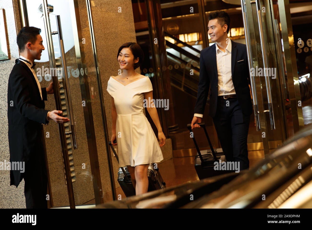 View of Couple leaving hotel hi-res stock photography and images - Alamy