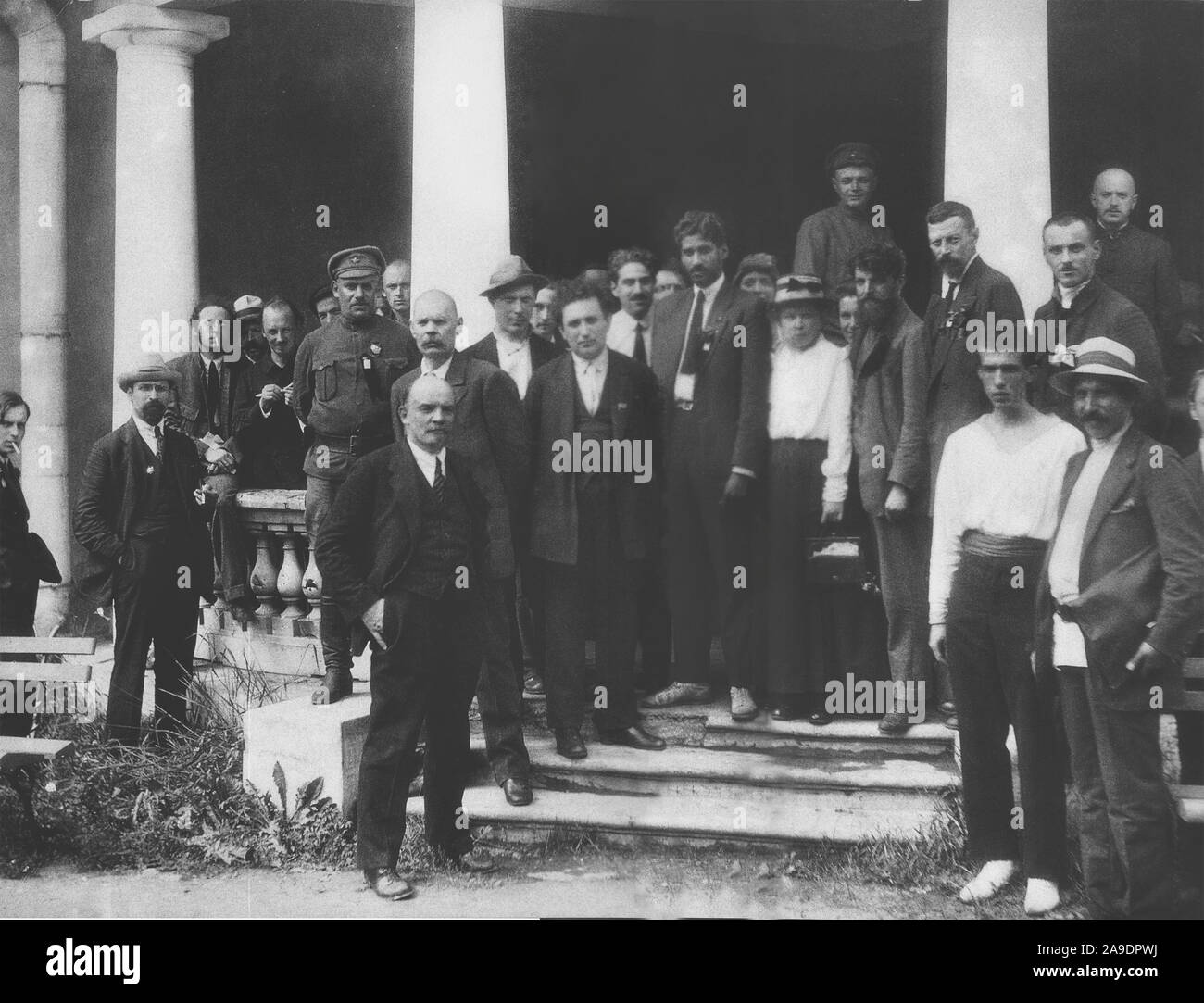 Delegates to the second congress of the Comintern at the Uritsky Palace in Petrograd. The recognized are: Lev Karakhan (second from left), Karl Radek (third, smoking), Nikolai Bukharin (fifth), Mikhail Lashevich (seventh uniform), Maxim Peshkov (Maxim Gorky's son) (behind the column), Maxim Gorky (ninth shaved), Vladimir Lenin (tenth, hands in pockets), Sergey Zorin (eleventh, with hat), Grigory Zinoviev (thirteenth, hands behind his back), Charles Shipman (Jesús Ramírez) (white shirt and tie), M.N. Roy (coat and tie), Maria Ulyanova (nineteenth, white blouse), Nicola Bombacci (with beard) and Stock Photo