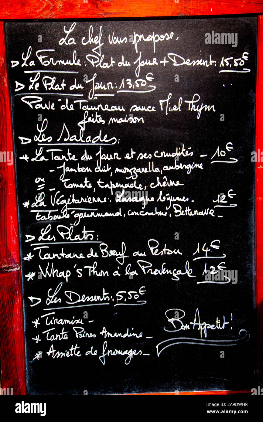 menu blackboard outside a restaurant in France Stock Photo