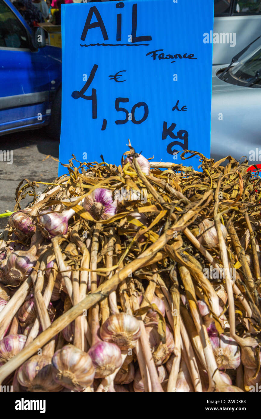 Garlic displayed at the open air market in Arles France Stock Photo