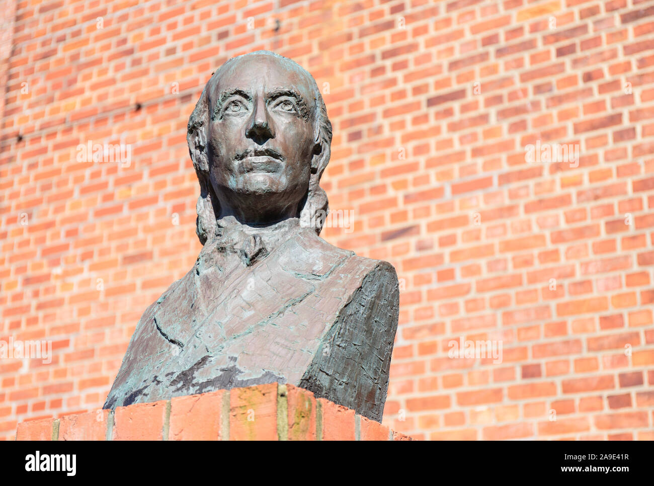 Europe, Germany, Lower Saxony, Otterndorf. Bust of Johann Heinrich Voss (1751-1826) in front of the Severi church. Stock Photo