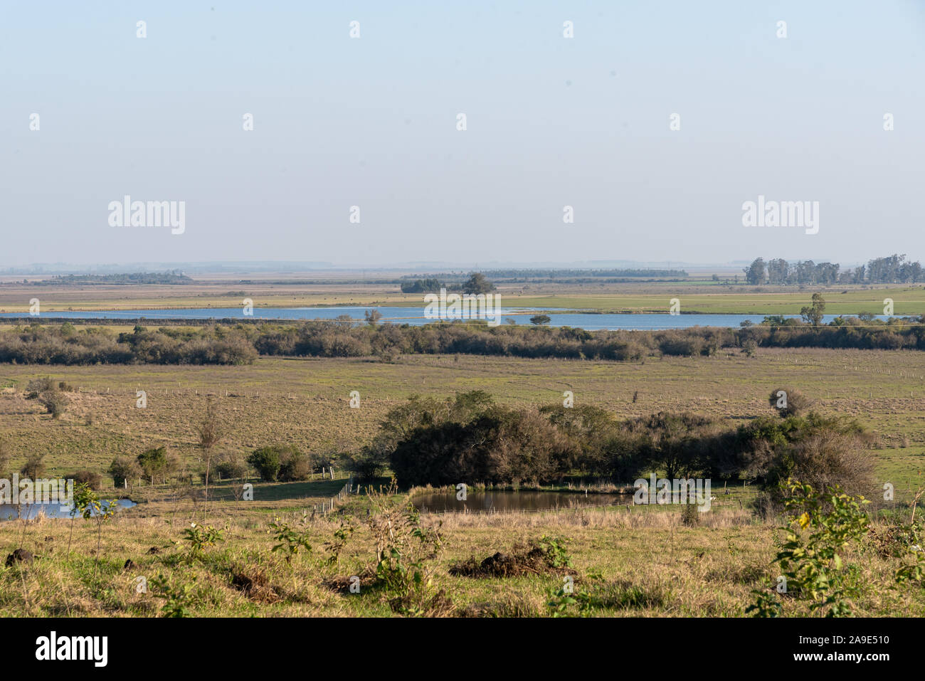 Rural landscape in southern Brazil, city of Mata in the state of Rio Grande do Sul. Two freshwater dams, one small in the foreground, and one in the b Stock Photo
