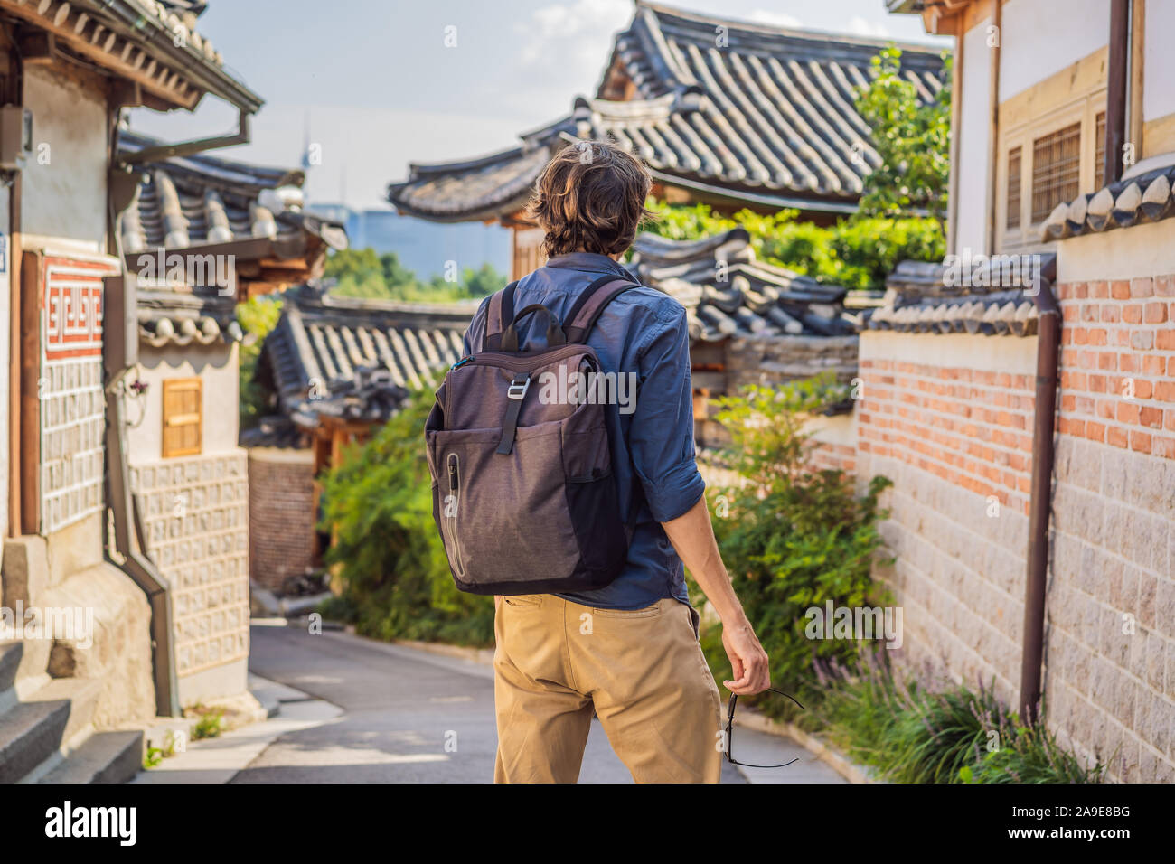 Young man tourist in Bukchon Hanok Village is one of the famous place ...
