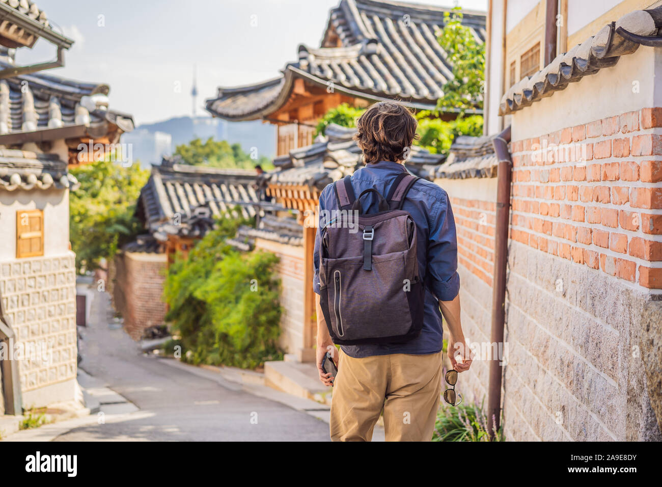 Young man tourist in Bukchon Hanok Village is one of the famous place ...