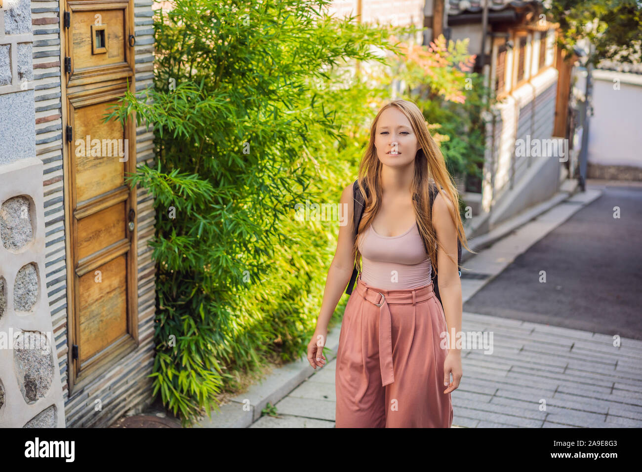 Young woman tourist in Bukchon Hanok Village is one of the famous place ...