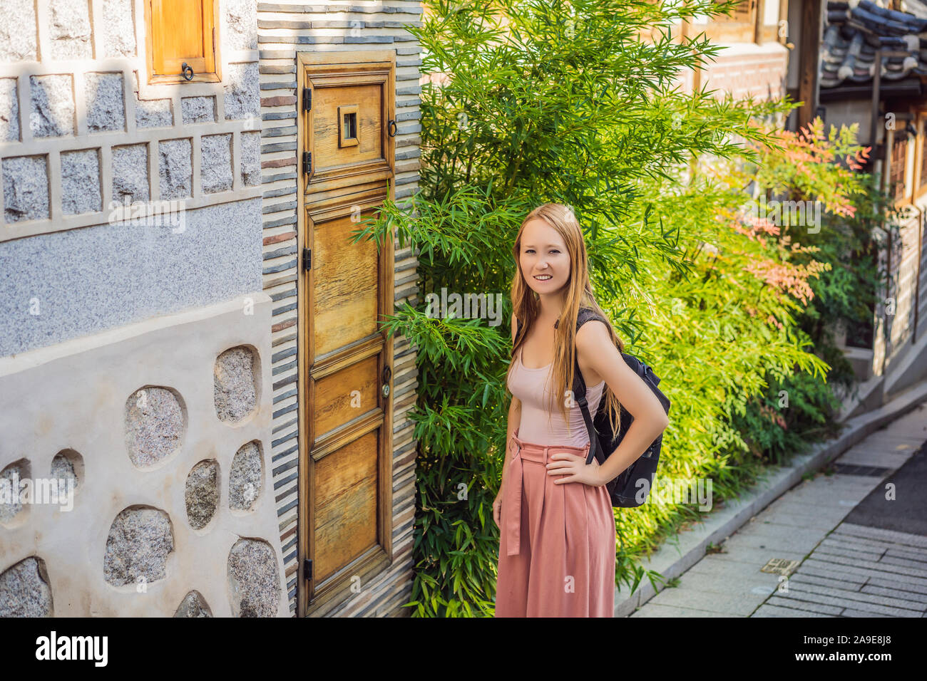 Young woman tourist in Bukchon Hanok Village is one of the famous place ...