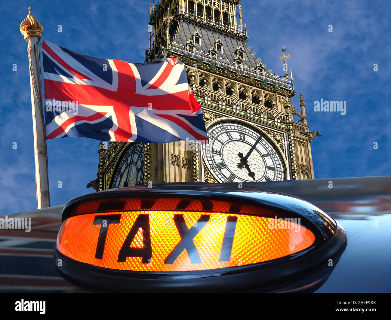 Union jack flagon pole , Big Ben and sign for taxi Stock Photo