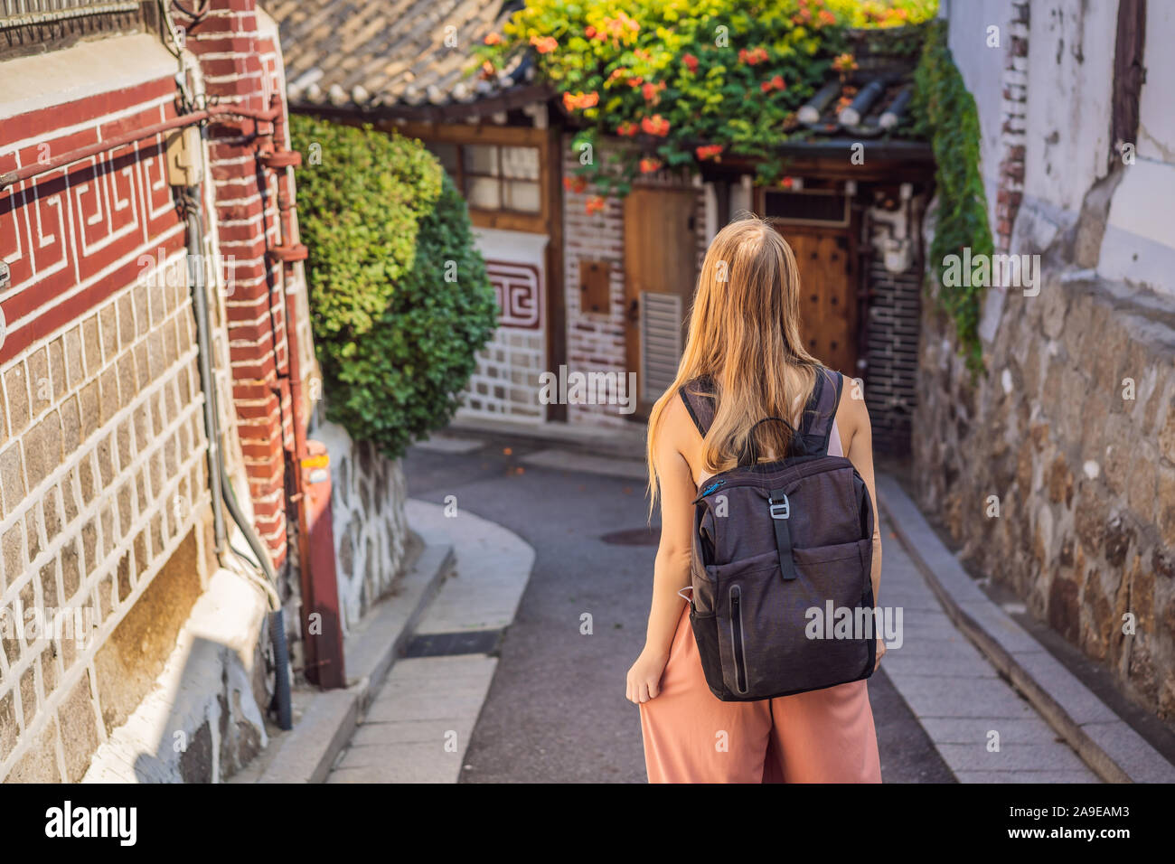 Young woman tourist in Bukchon Hanok Village is one of the famous place ...