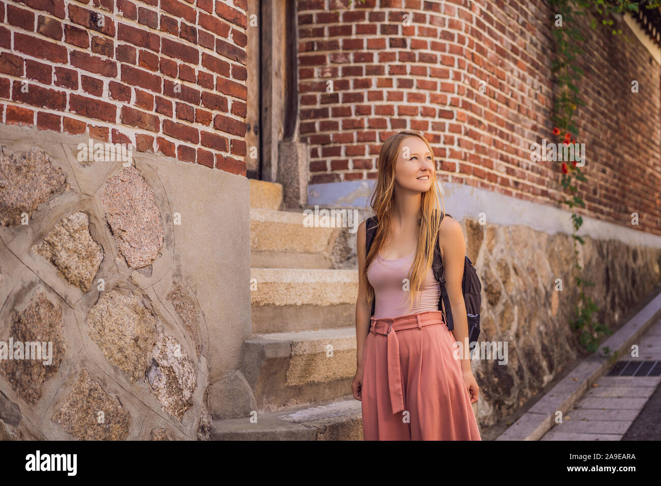 Young woman tourist in Bukchon Hanok Village is one of the famous place ...