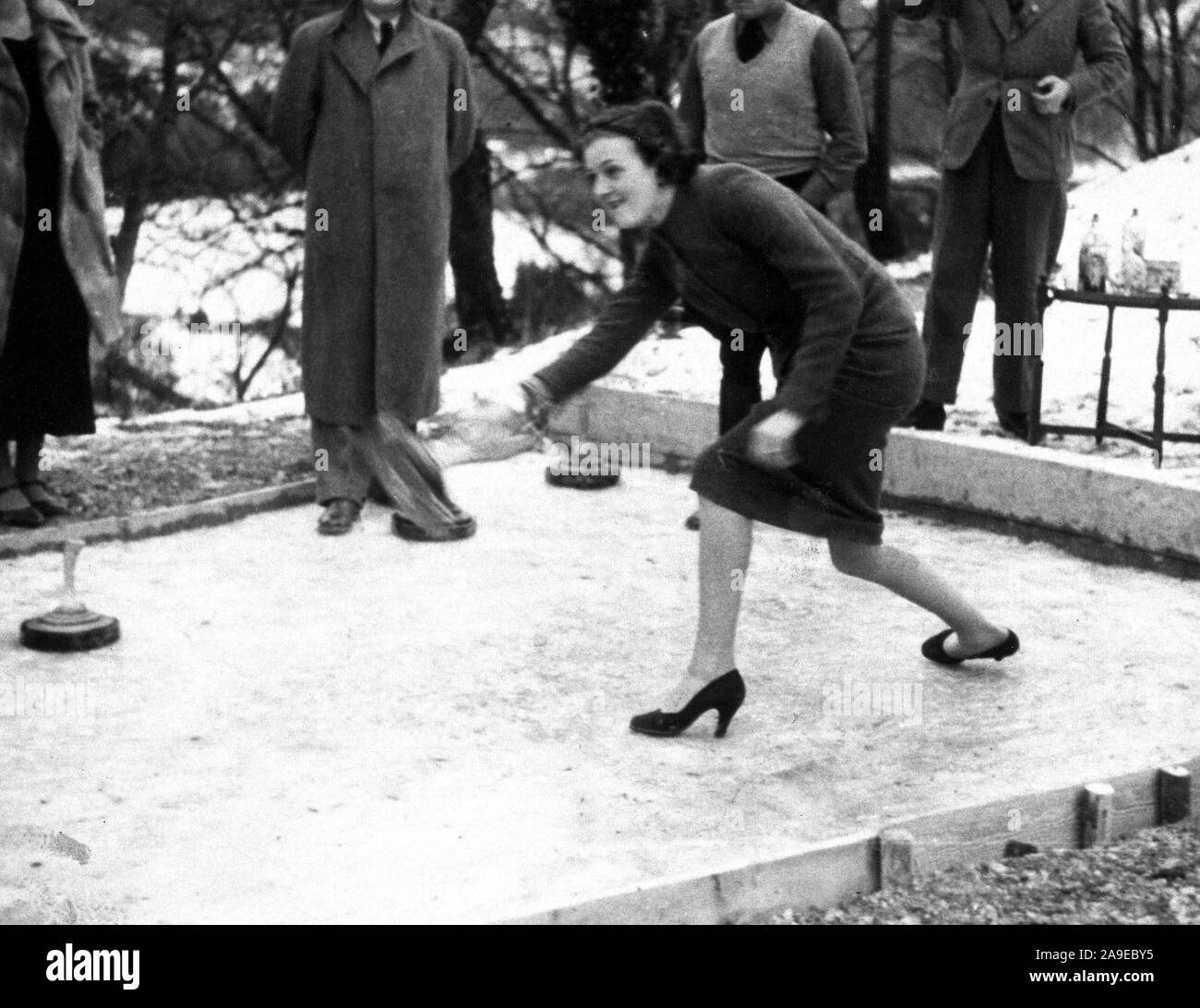 Eva Braun Collection (Album 2) - Woman playing some type of curling game outdoors ca. 1930s Stock Photo