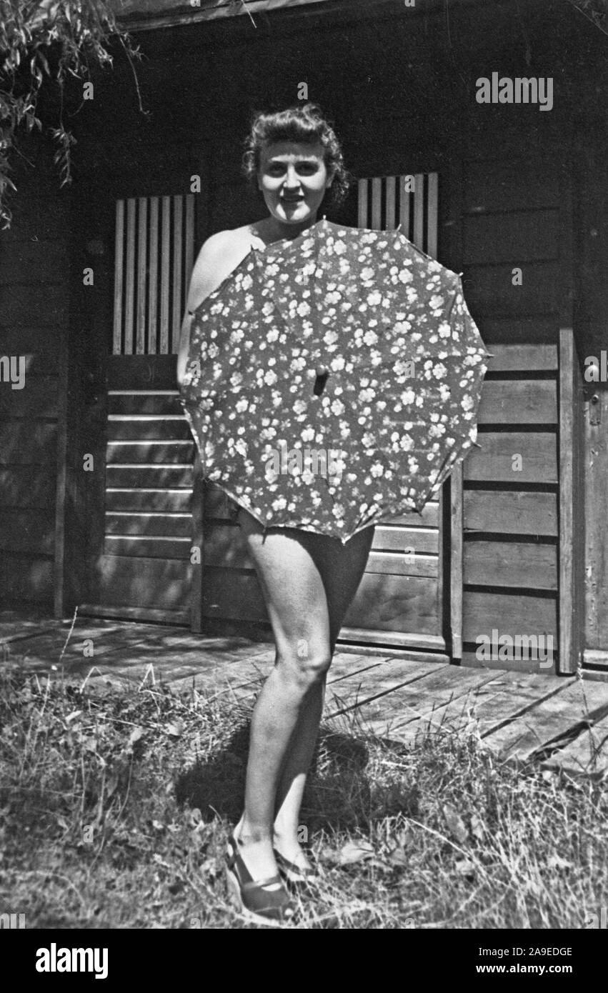 Eva Braun Collection (devet) - Eva Braun wearing only an umbrella ca. late 1920s ? Stock Photo