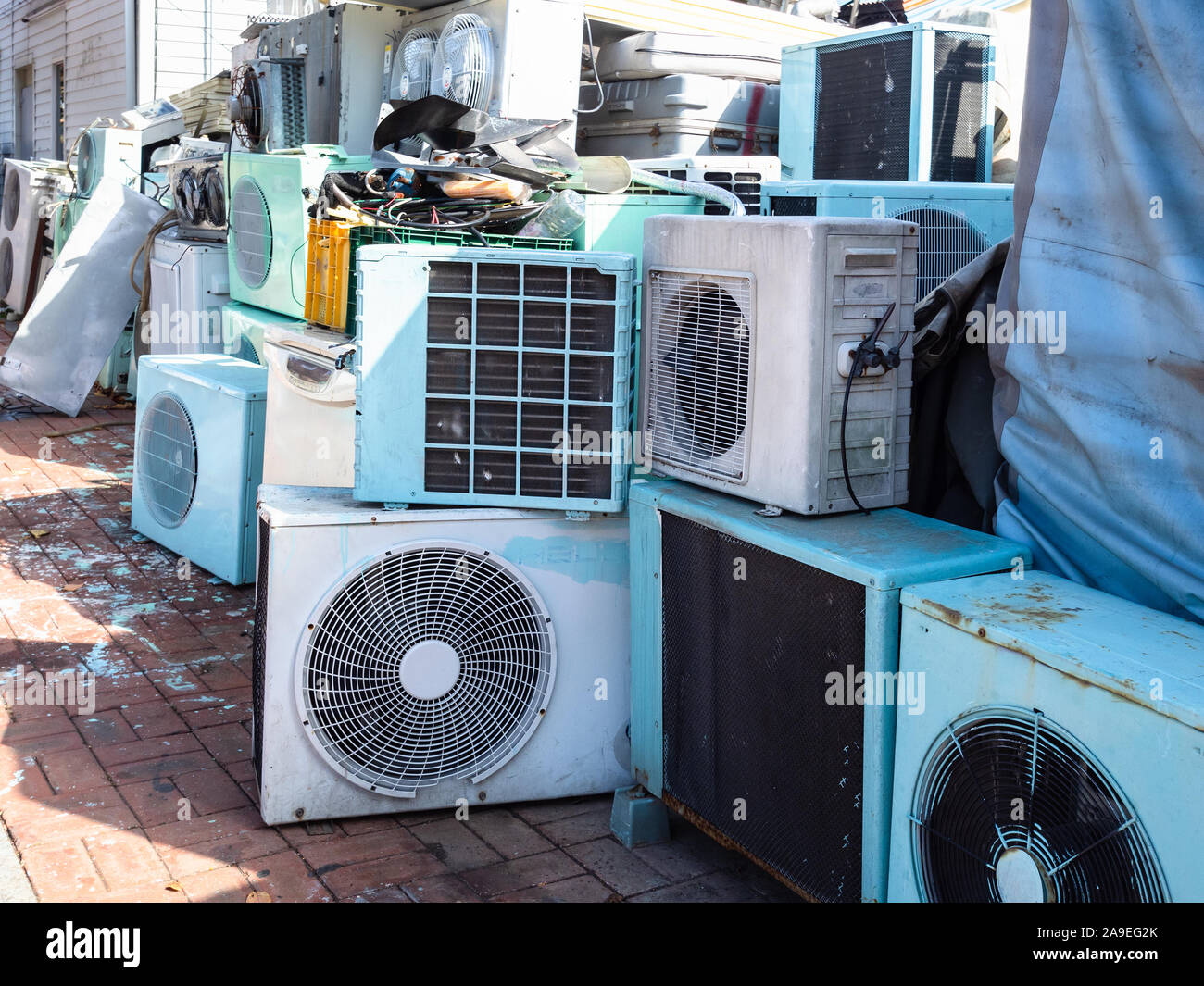 old air conditioners on street next to the home appliance repair shop in Sokcho city, South Korea Stock Photo