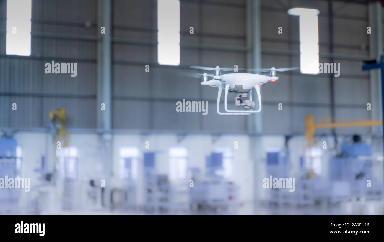 Drone camera surveying over a smart factory using internet of things Stock Photo