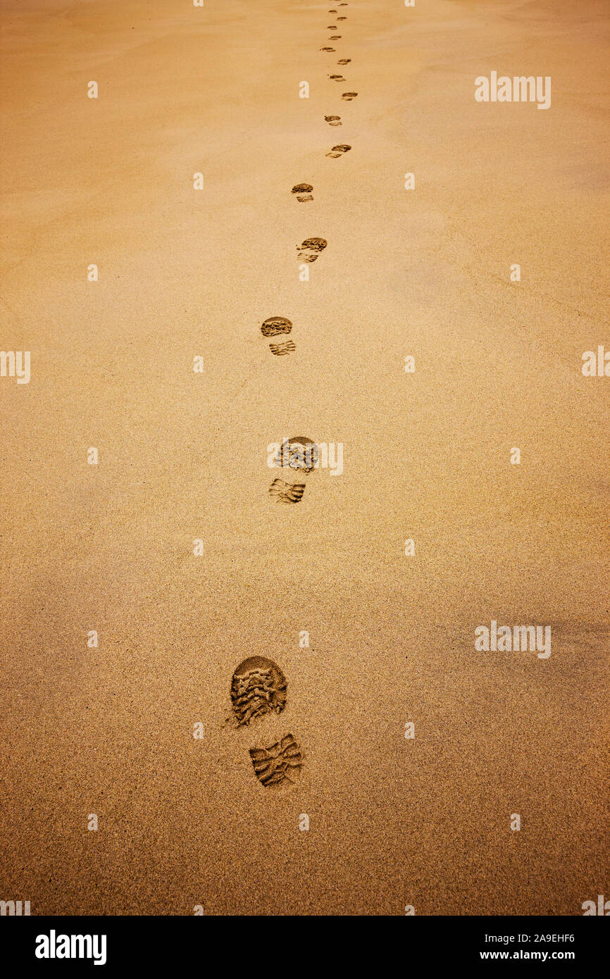 Shoe prints in the sand Stock Photo
