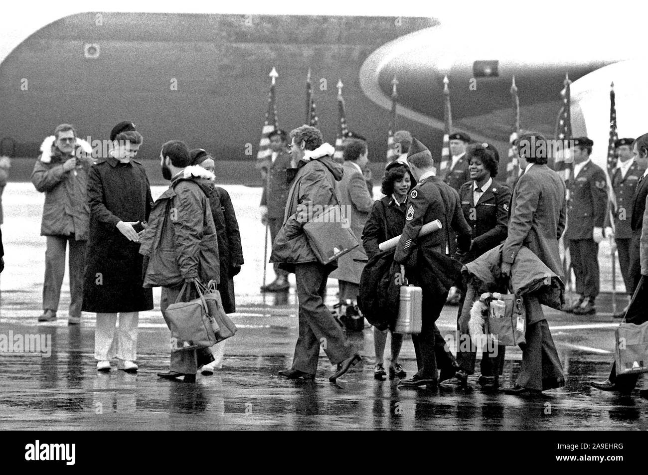 Former hostages are bid farewell by base personnel upon their departure for the United States.  The 52 hostages were hospitalized for a few days after their release from Iran. Stock Photo