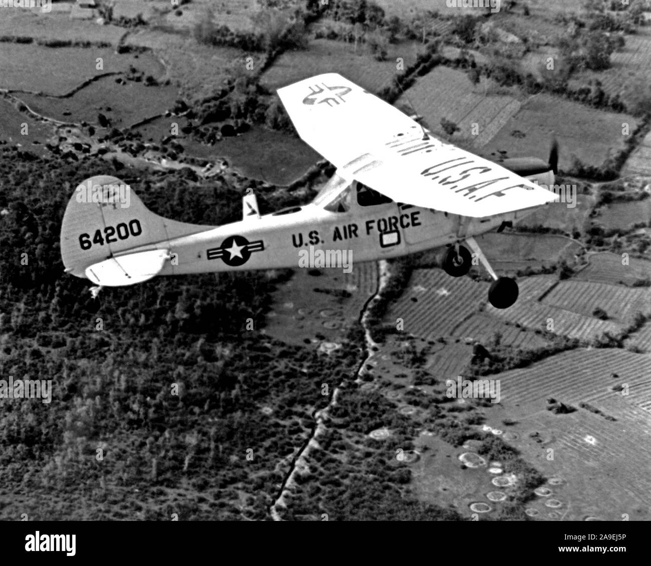 1967 - An air-to-air right side view of a U.S. Air Force 0-1E Bird Dog aircraft.  The aircraft is used as a forward air control aircraft throughout South Vietnam. Stock Photo