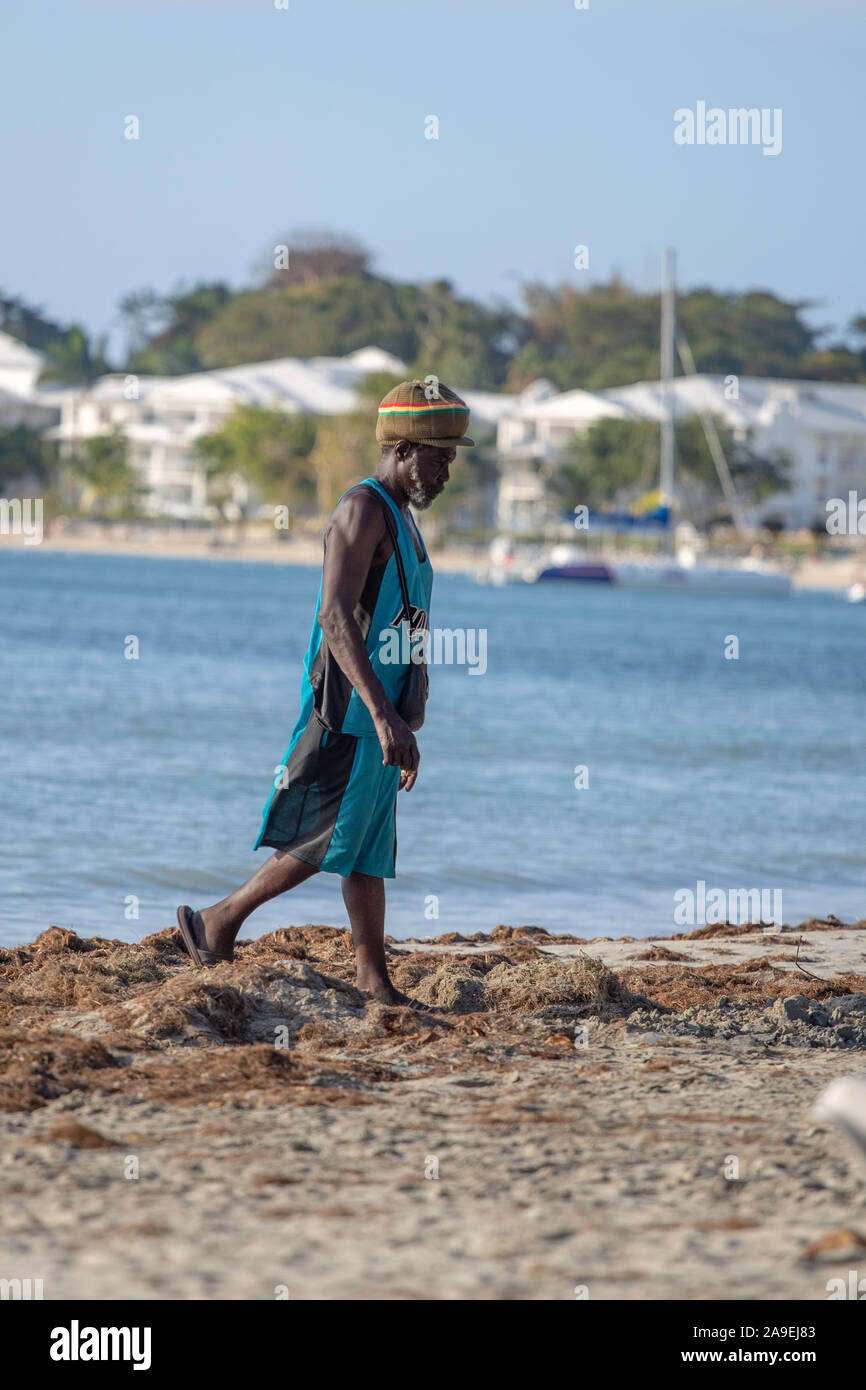 Walking and smoking ganja in Jamaica Stock Photo