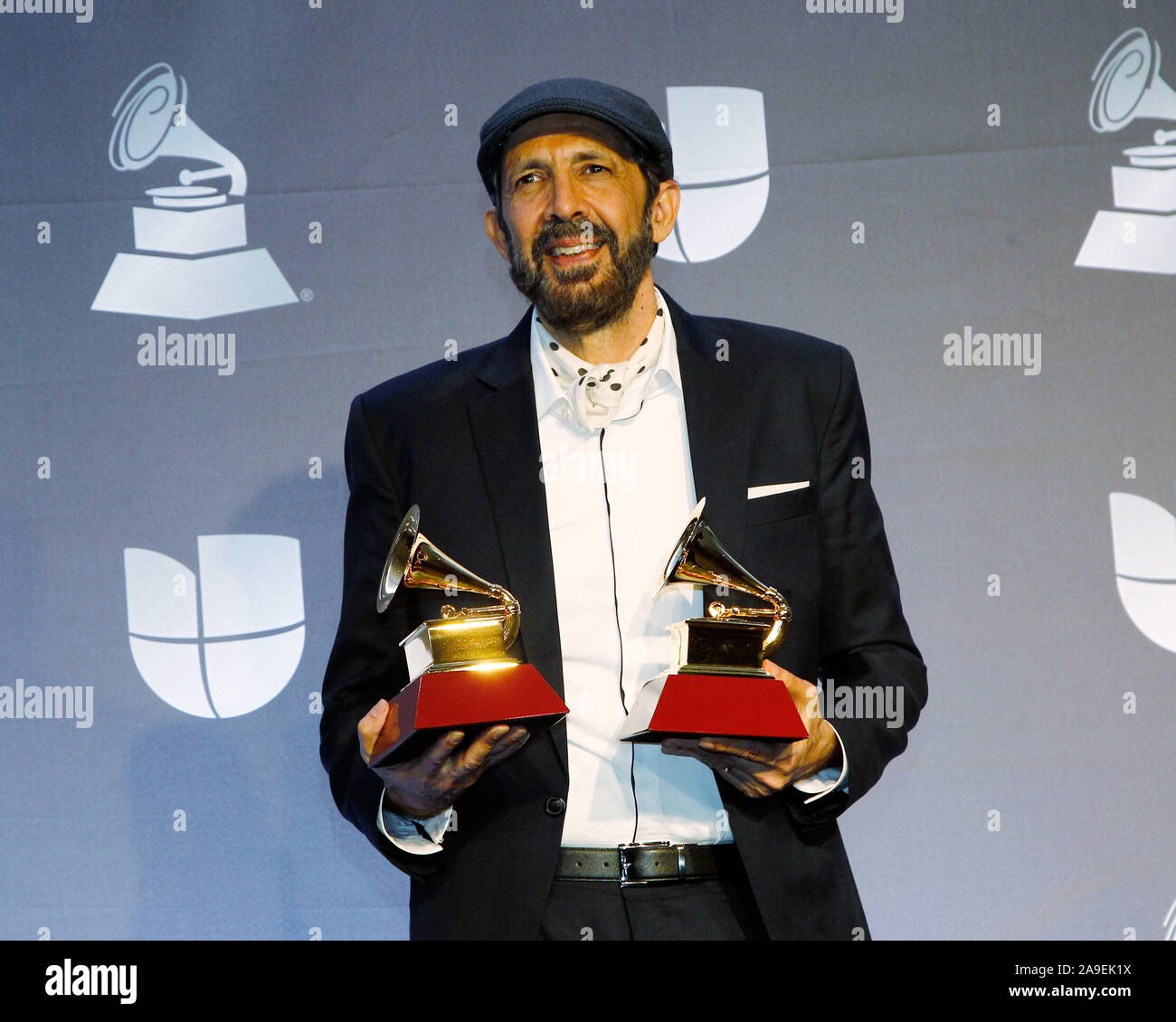Las Vegas, United States. 14th Nov, 2019. Juan Luis Guerra appears backstage with the awards for best contemporary/tropical fusion album for 'Literal' and best tropical song for 'Kitipun' during the 20th annual Latin Grammy Awards at the MGM Garden Arena in Las Vegas, Nevada on Thursday, November 14, 2019. Photo by James Atoa/UPI Credit: UPI/Alamy Live News Stock Photo