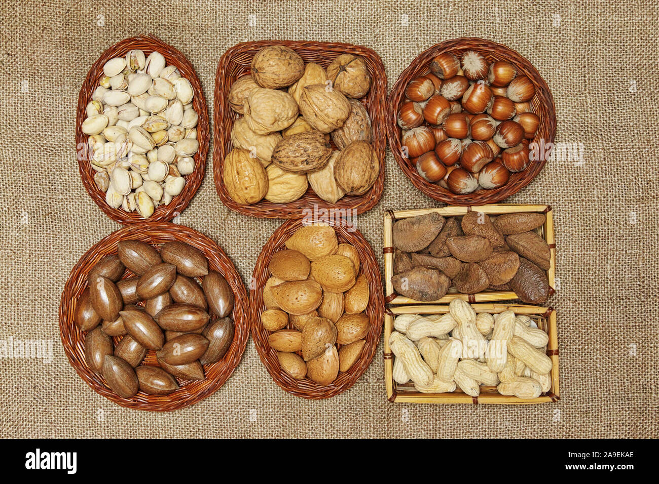 still life of edible seeds put in small baskets of different shapes Stock Photo