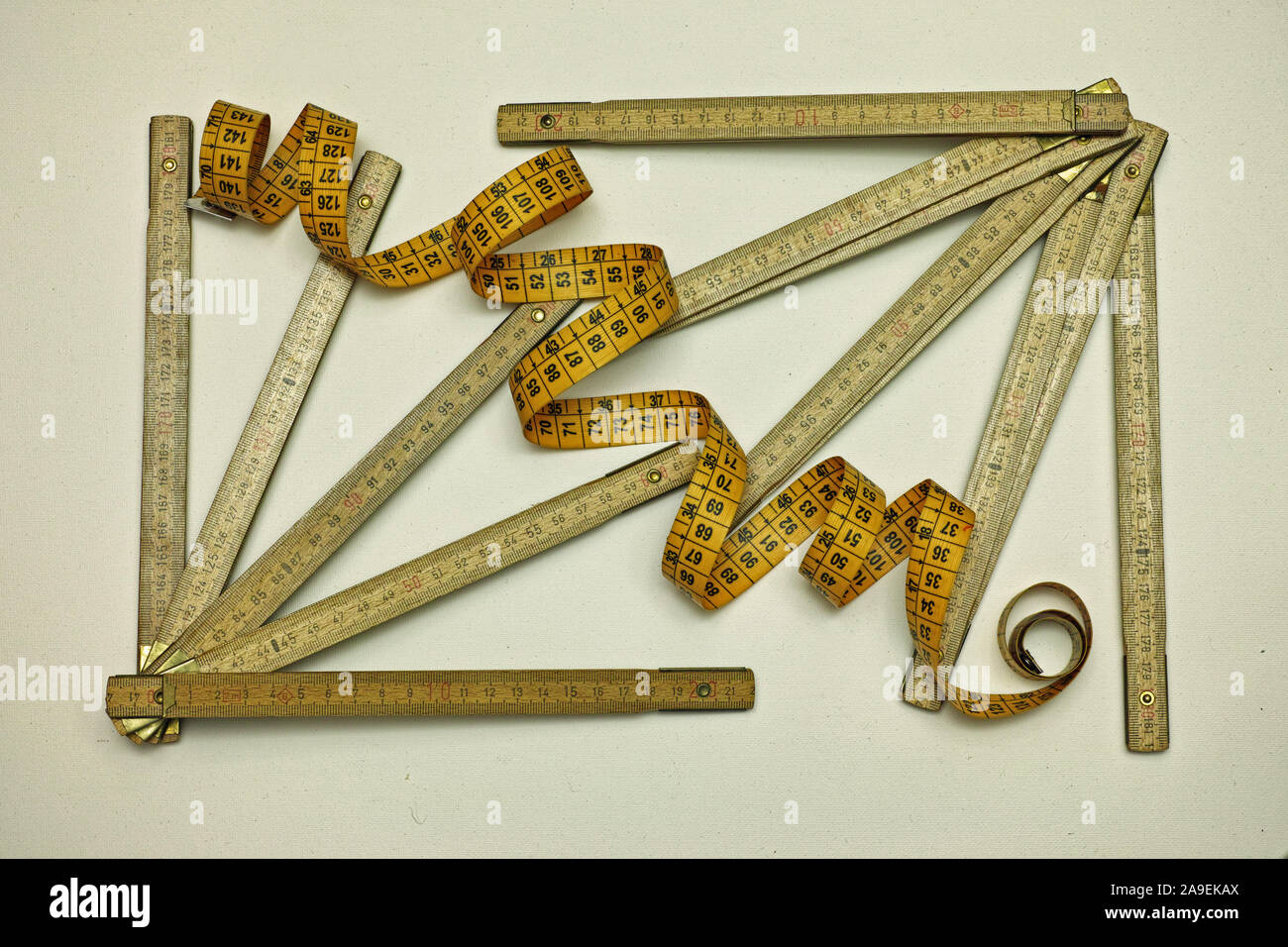 https://c8.alamy.com/comp/2A9EKAX/still-life-with-meters-for-carpenters-and-tape-for-tailoring-2A9EKAX.jpg