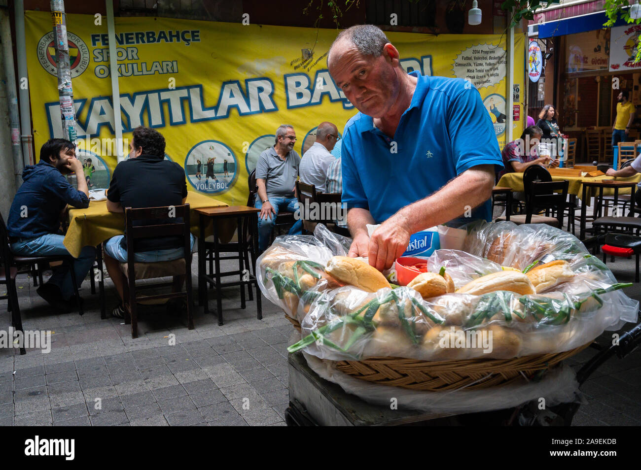 Food vendor near gaming tables, Kadıköy, Istanbul, Turkey Stock Photo