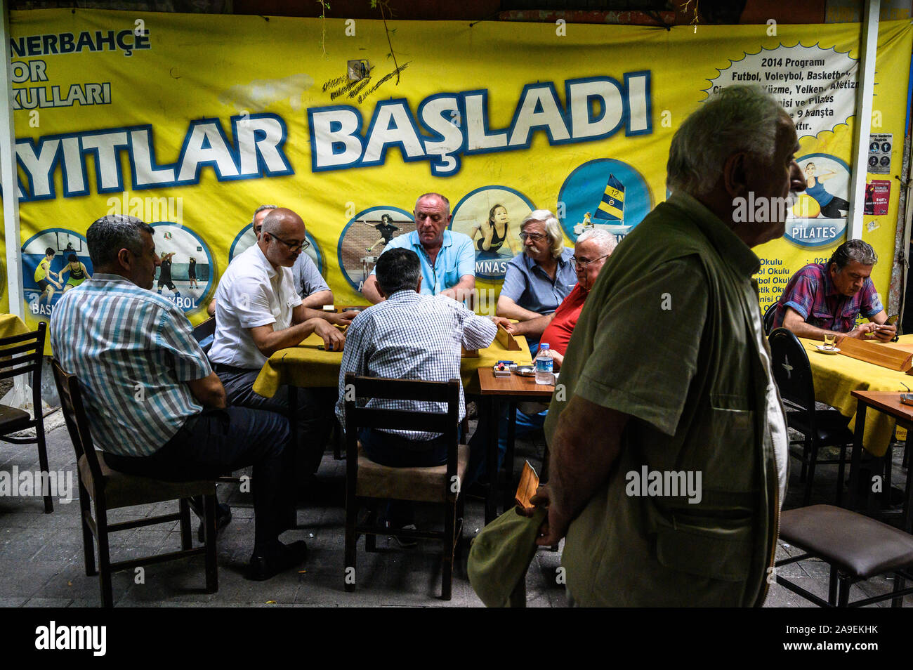 Man passing by gaming tables, Kadıköy,, Istanbul, Turkey Stock Photo