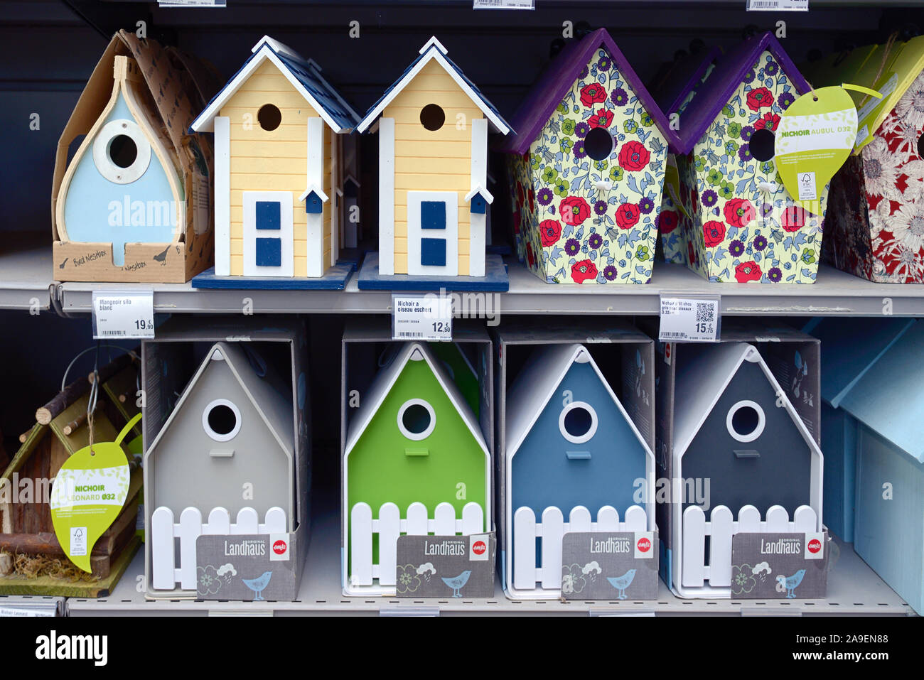 Display or Collection of Colourful Bird Boxes or Nesting Boxes for Sale in Shop, Store or Garden Centre Stock Photo