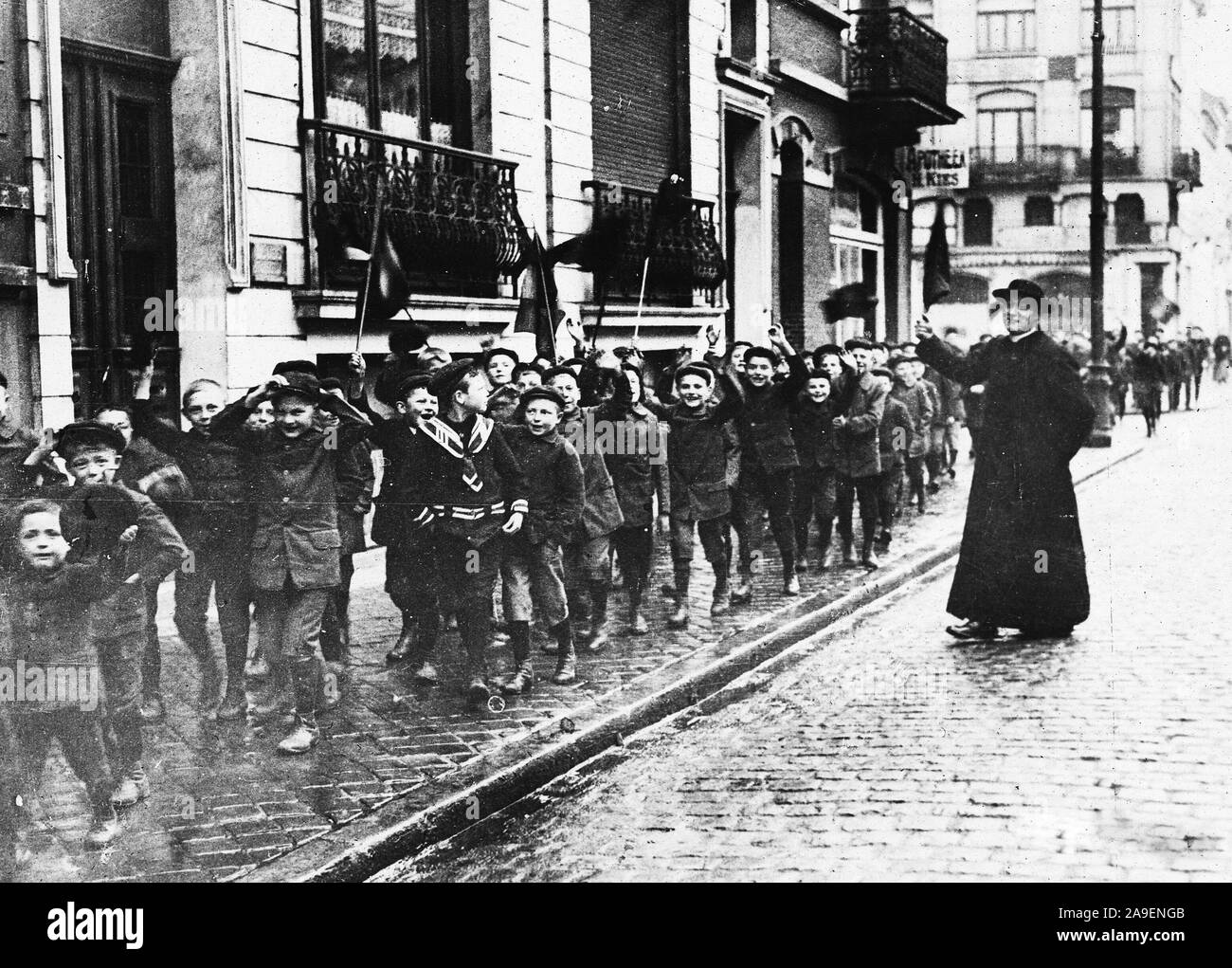 Belgium - Children of Ostend rejoice at being liberated. The joy and gladness that fill these little hearts at being liberated from the Hun rule is shown by their smiling faces and cheering Stock Photo