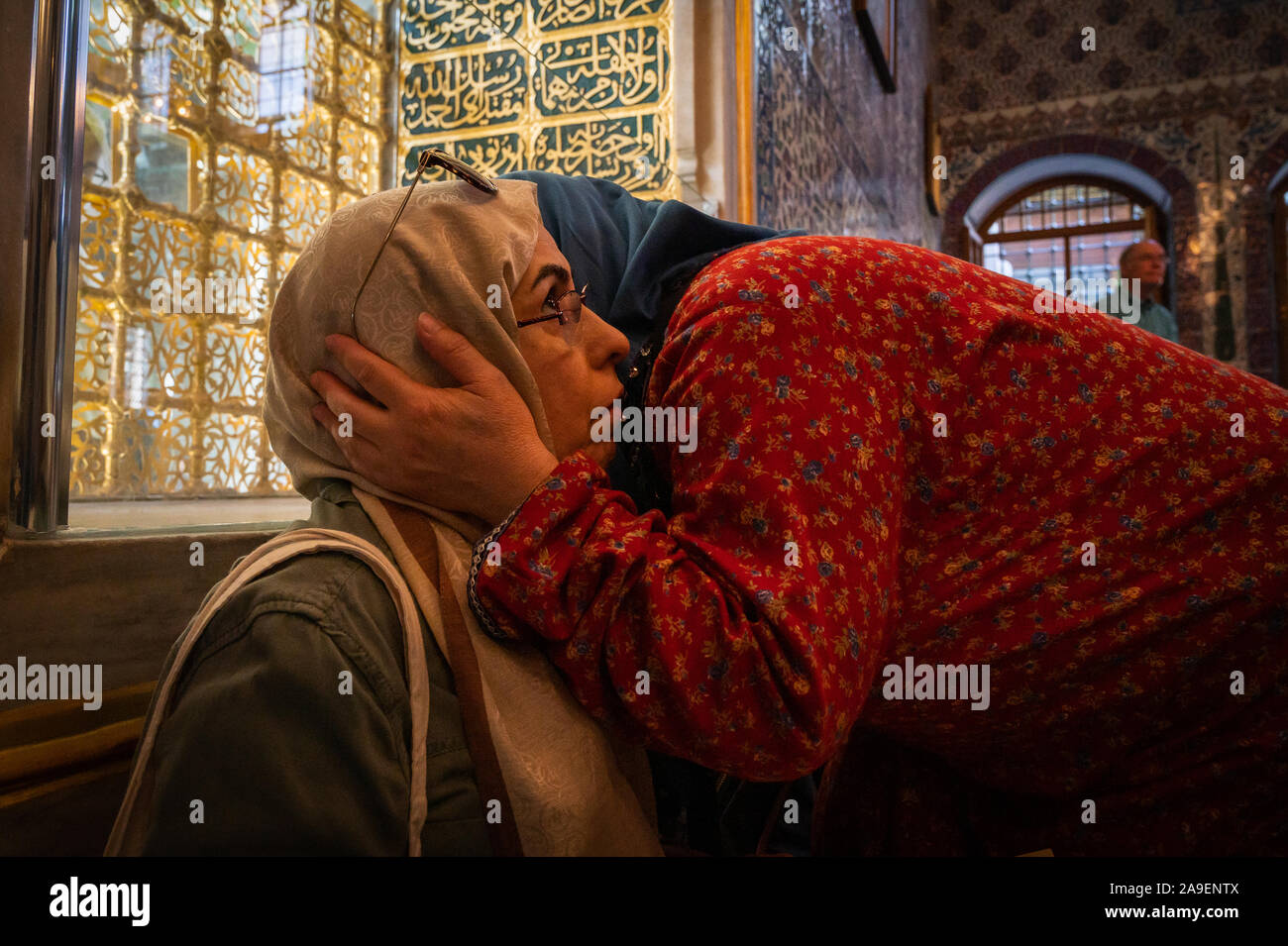 Women in the shrine of Abu Ayyub al-Ansari, Eyup Sultan Mosque, Istanbul, Turkey. Stock Photo