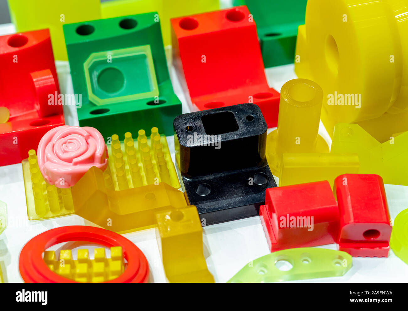 Engineering plastics. Plastic material used in manufacturing industry. Global engineering plastic market concept. Polyurethane and abs plastic parts Stock Photo