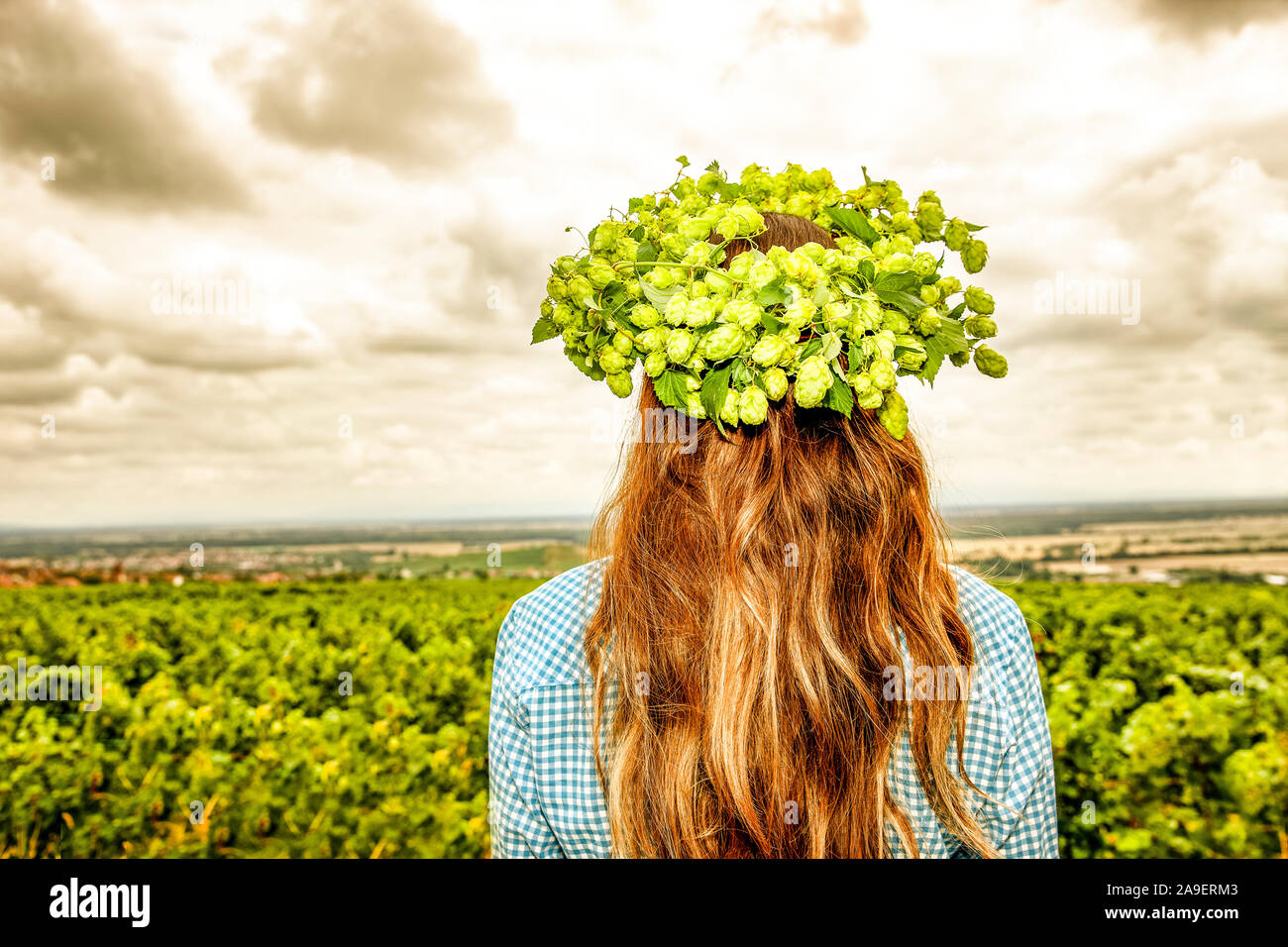 Woman with hop-wreath Stock Photo