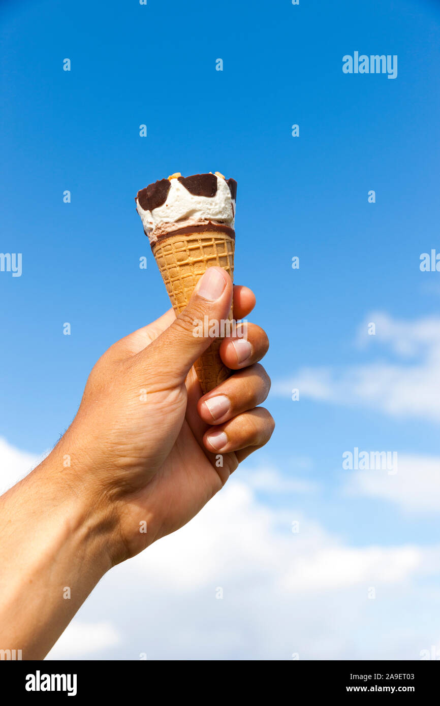 Ice cream in hand Stock Photo Alamy