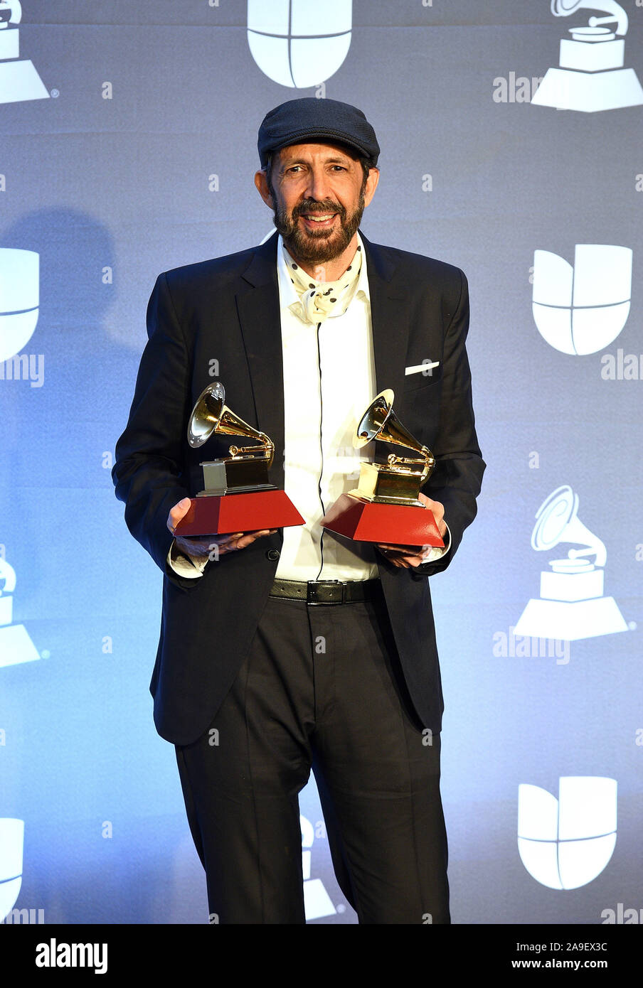 Las Vegas, USA . 14th Nov, 2019. Juan Luis Guerra poses with the awards for 'Best Contemporary Tropical Fusion Album' and 'Best Tropical Song' in the press room during the 20th annual Latin GRAMMY Awards at MGM Grand Garden Arena on November 14, 2019 in Las Vegas, Nevada. Photo: imageSPACE/MediaPunch/Alamy Live News  Stock Photo