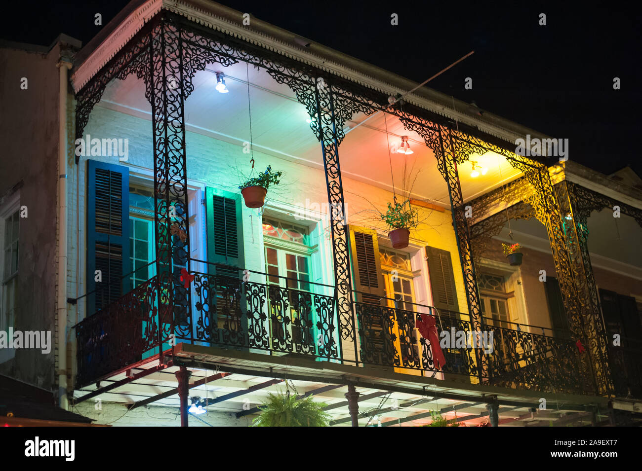 Bourbon Street balcony by night in New Orleans. This historic street in