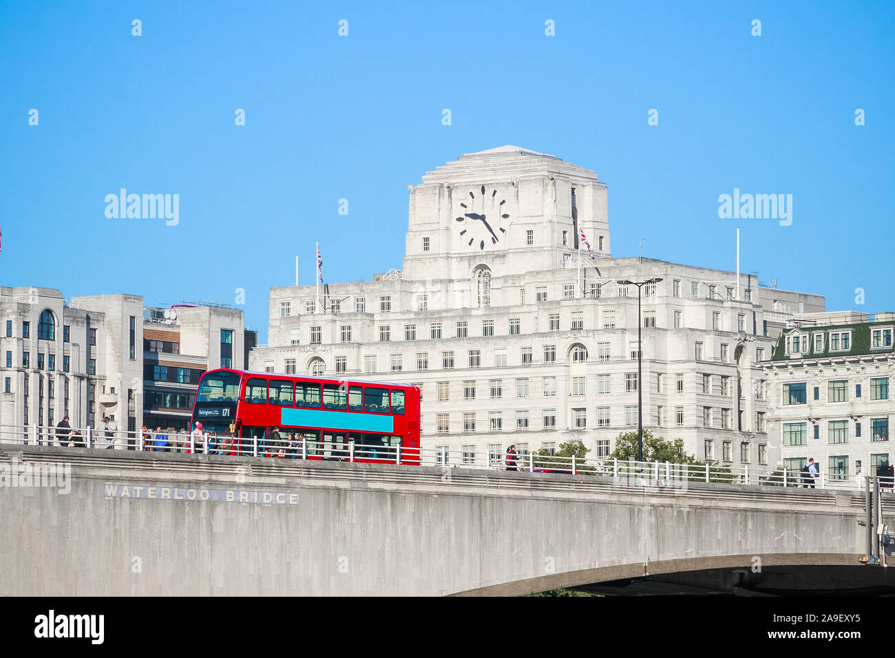 Waterloo Bridge with a passing bus and facade of Shell Mex House in the background in London Stock Photo