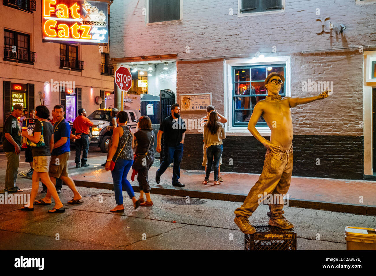 Street artist performing as a living statue on Bourbon Street by night