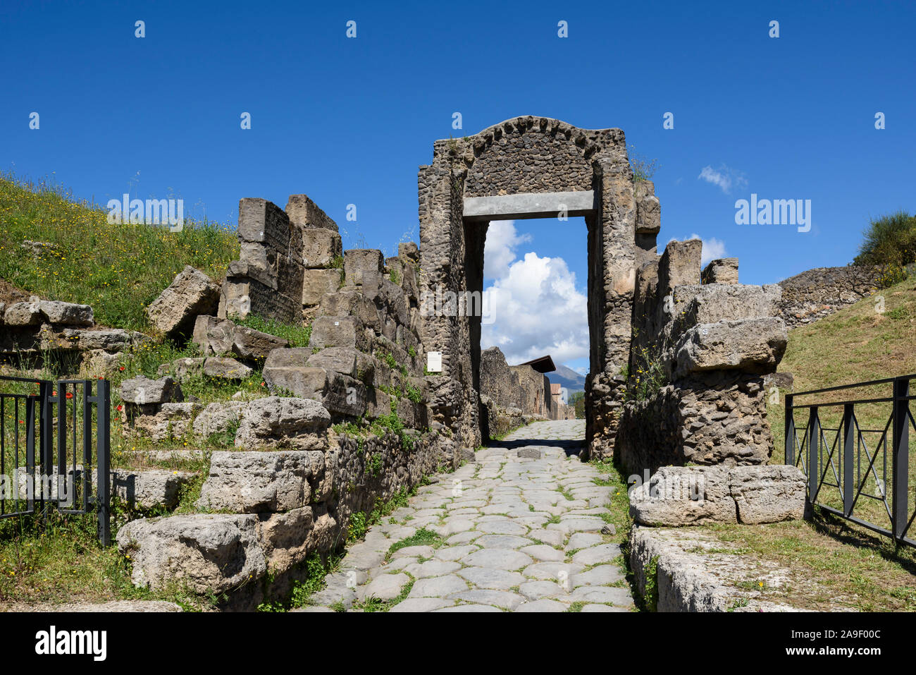 Pompei. Italy. Archaeological site of Pompeii. Porta Nocera (Nuceria Gate) and remains of the defensive walls (cinta muraria).  The Nocera gate provid Stock Photo