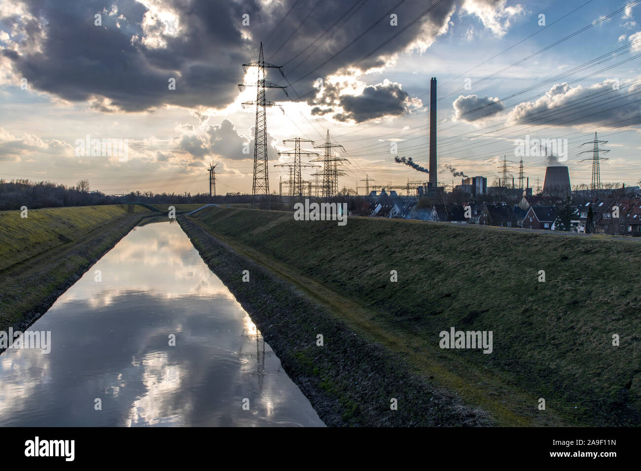 The river Emscher, canalised, in Essen-Karnap, on the right the RWE waste-to-energy plant Karnap, Stock Photo